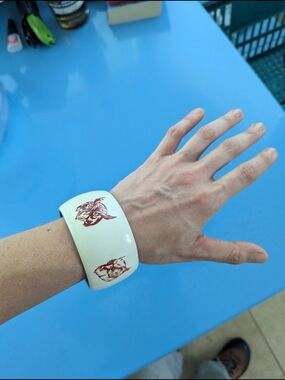 White Decorative Bangle Bracelet with Red Floral Motif